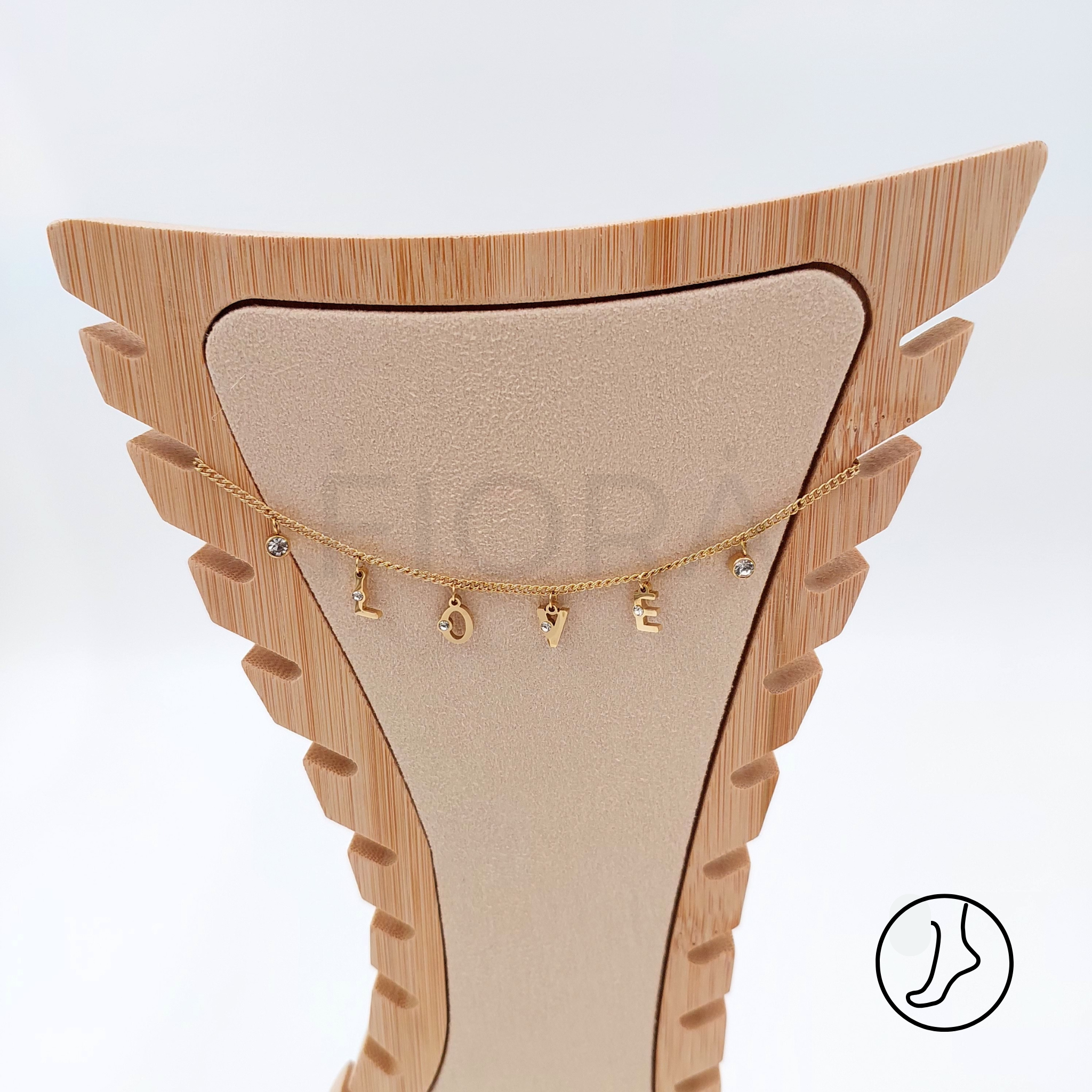 Gold anklet with LOVE letter charms and zircon stones.