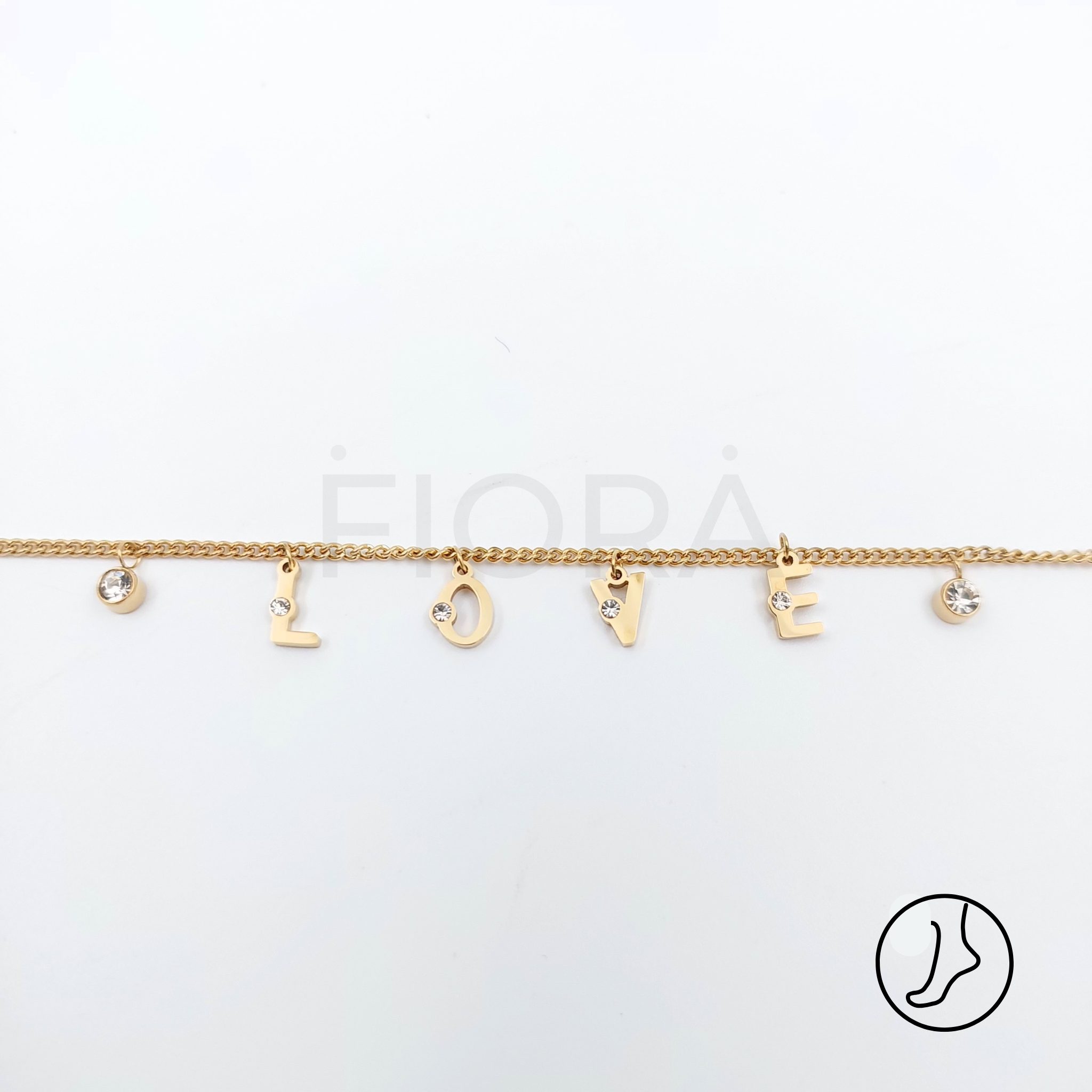 Gold anklet with LOVE letter charms and zircon stones.