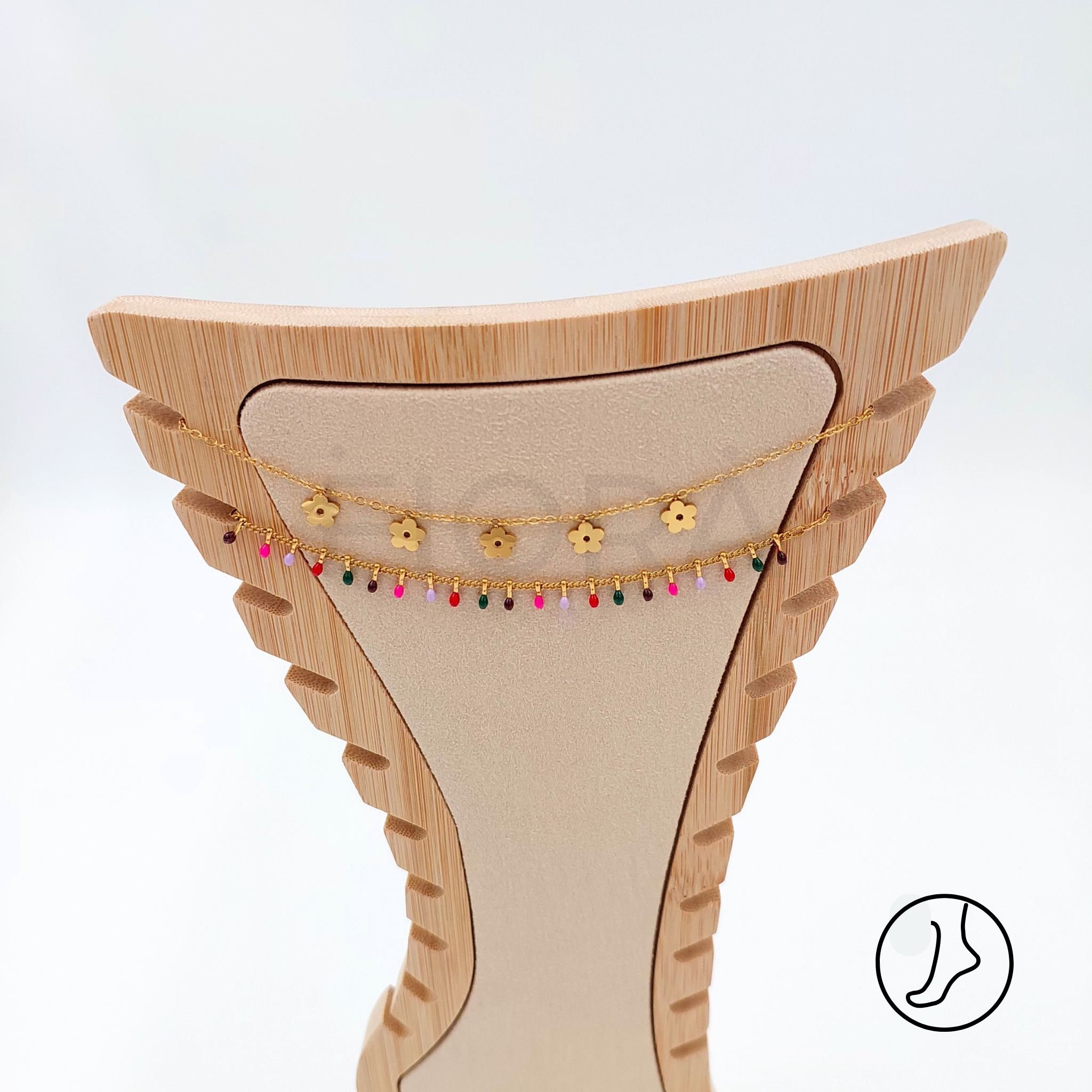 Floral motif gold anklet with double colorful chain.