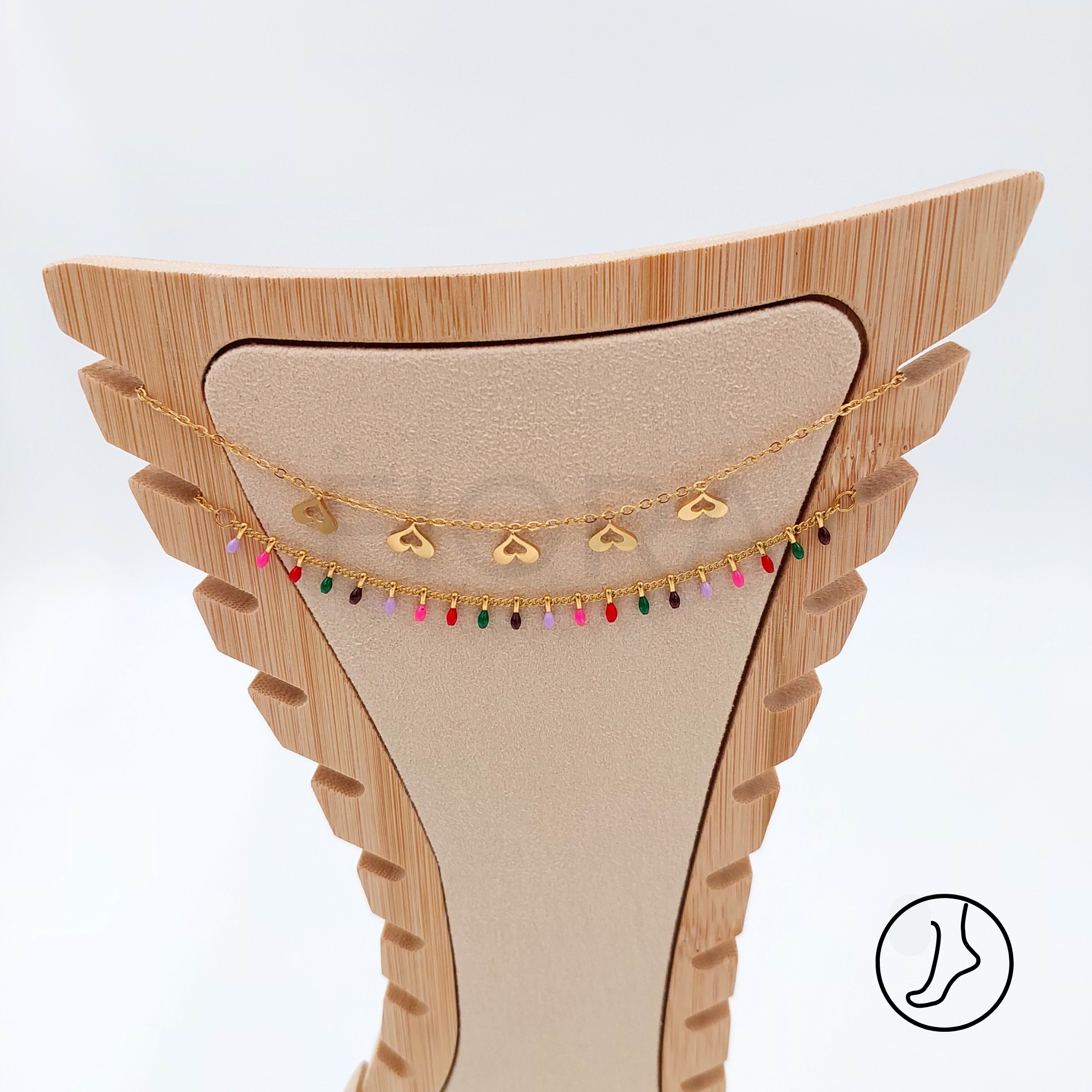 Double gold-plated anklet with heart charms and colorful beads.