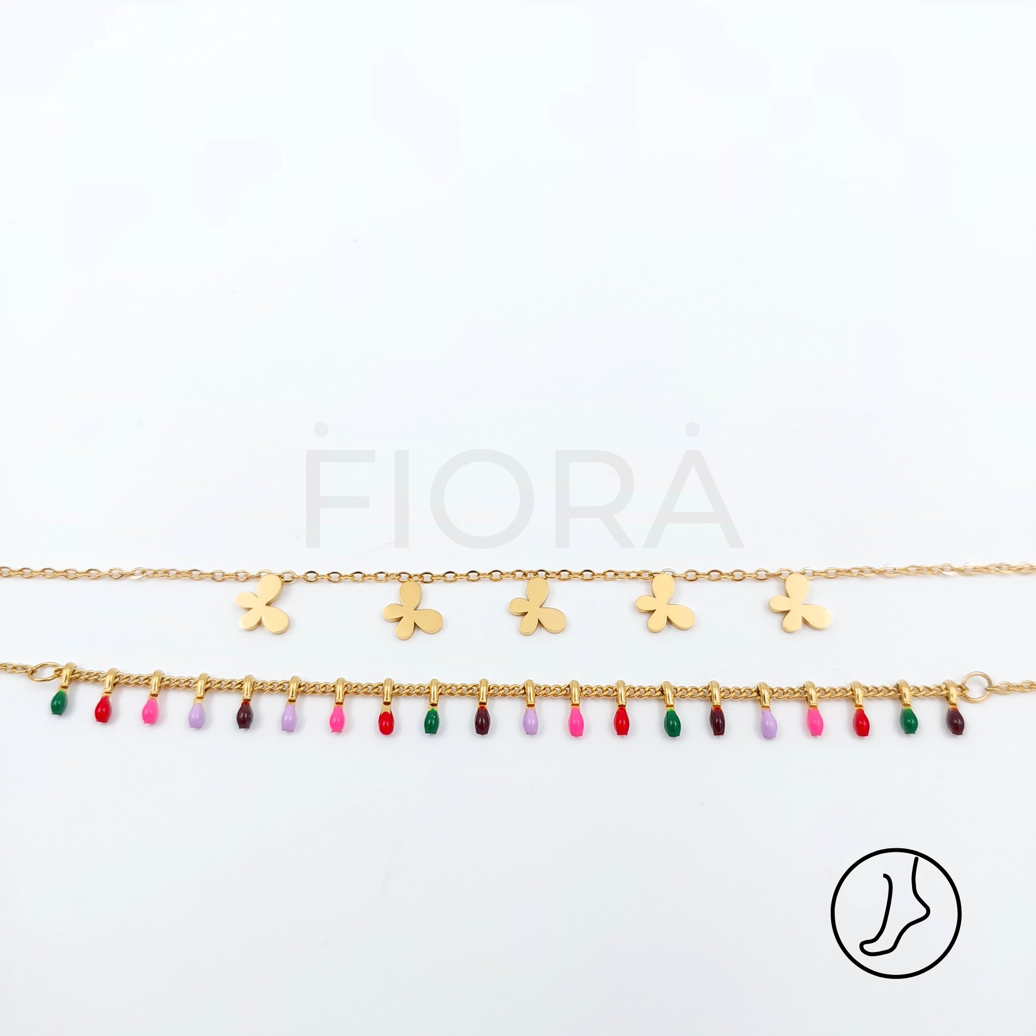 Double-chain anklet in gold with joyful floral charms and colorful beads.