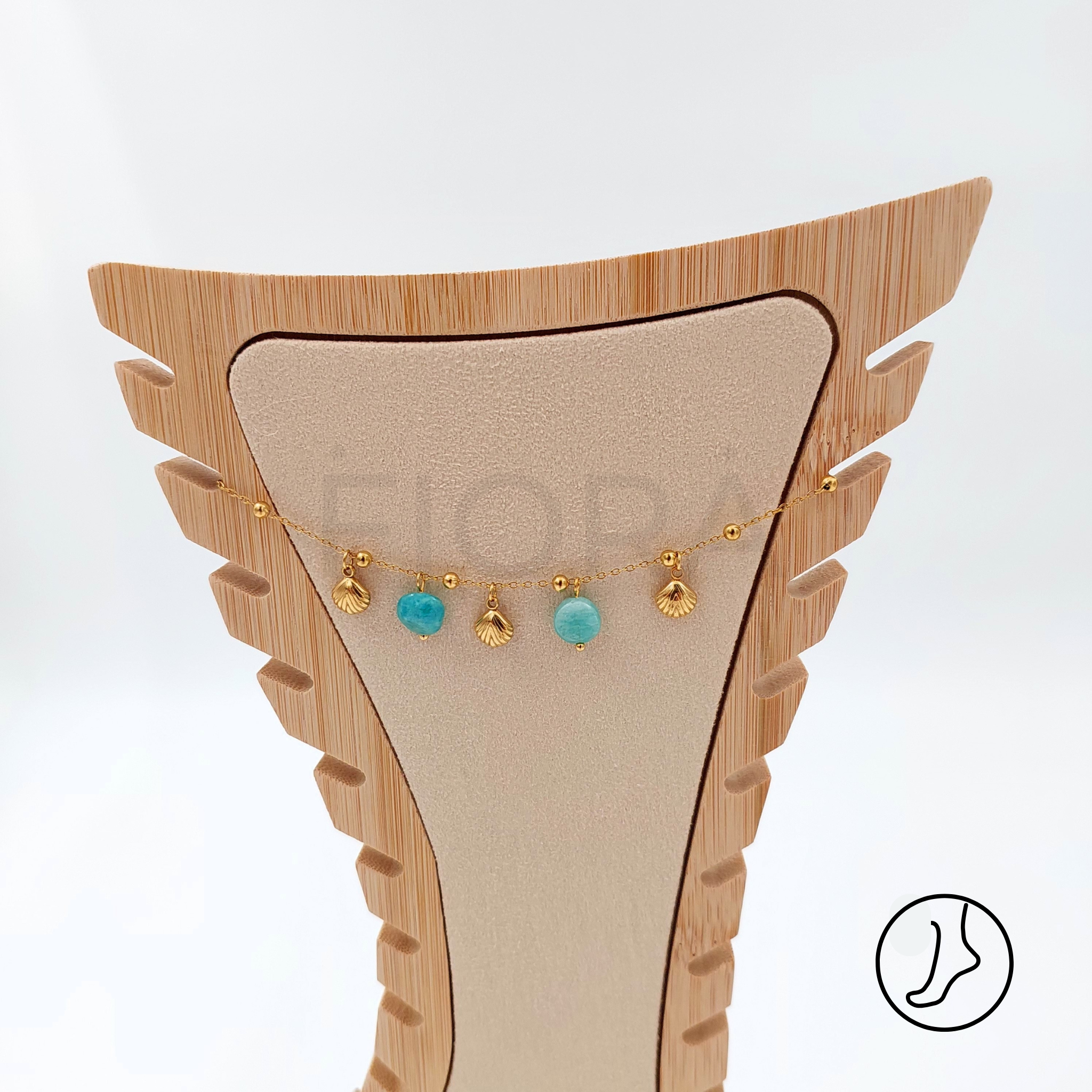 Stylish stainless steel anklet with turquoise and gold shell details.