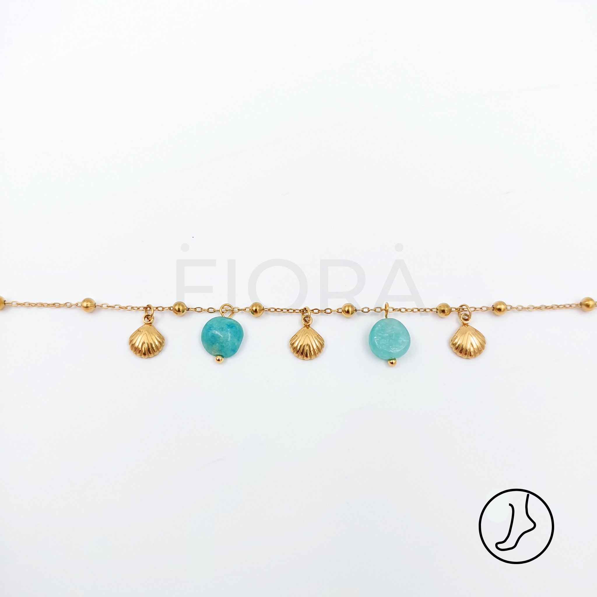 Stylish stainless steel anklet with turquoise and gold shell details.