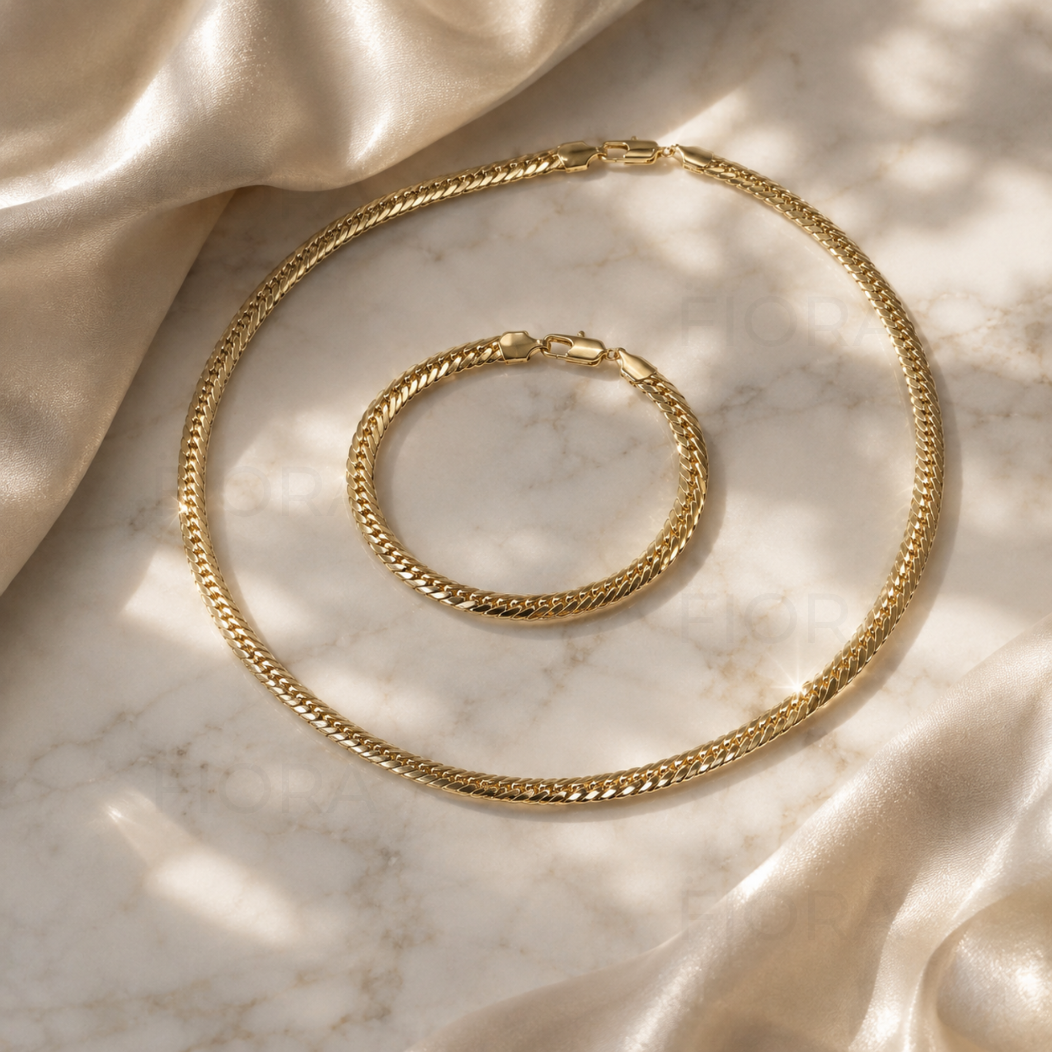 Vista Signature gold necklace and bracelet matching jewelry set with polished flat chain design on a white background.