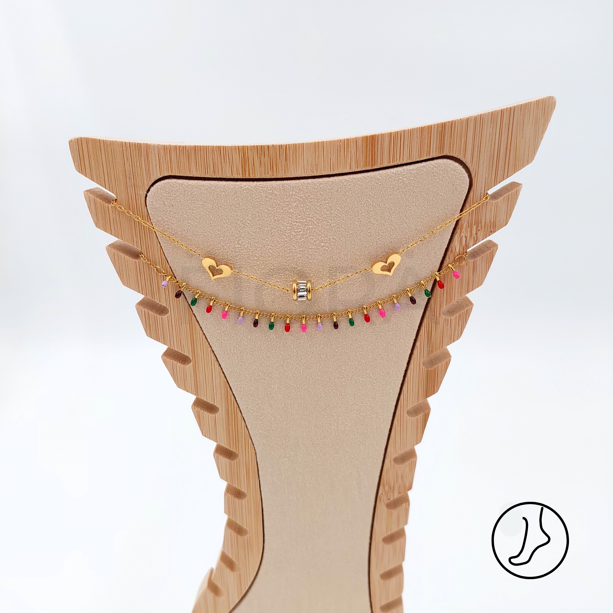 Double gold-plated anklet with hearts and colorful beads.