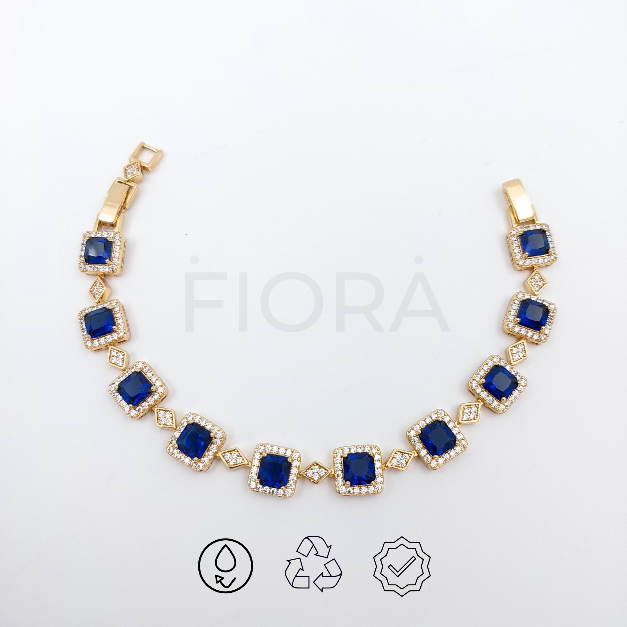 Elegant gold bracelet with square zircon stones and diamond-shaped gold links.